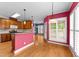 Inviting kitchen showcasing wooden cabinets, stainless appliances, and an airy breakfast nook with natural light at 7405 Pine Summit Dr, Fuquay Varina, NC 27526