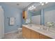 Bright bathroom with double sink vanity and updated fixtures, in a neutral color palette at 7705 Astoria Pl, Raleigh, NC 27612
