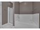 Well-maintained bathroom featuring a shower, a bathtub, and clean white fixtures at 7705 Astoria Pl, Raleigh, NC 27612