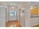 Inviting foyer with hardwood floors, and access to the kitchen and other rooms at 7705 Astoria Pl, Raleigh, NC 27612