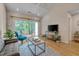 Comfortable living area with deck access, providing a relaxing and bright space for entertainment at 7705 Astoria Pl, Raleigh, NC 27612