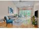 Bright living room boasts vaulted ceilings, a comfortable seating area, and access to an outdoor deck at 7705 Astoria Pl, Raleigh, NC 27612