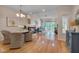 Spacious living room with hardwood floors, a fireplace, and ample natural light at 7705 Astoria Pl, Raleigh, NC 27612