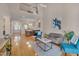 Open concept living area showcasing hardwood floors, a fireplace, and seamless flow to dining and kitchen at 7705 Astoria Pl, Raleigh, NC 27612