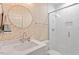 Bathroom featuring a glass enclosed shower, modern vanity and designer wallpaper at 811 E Lane St, Raleigh, NC 27601
