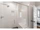 Modern bathroom featuring a tiled shower with glass door and built-in seat at 811 E Lane St, Raleigh, NC 27601
