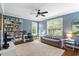 Comfortable bedroom with built-in bookshelves, a ceiling fan and natural light at 811 E Lane St, Raleigh, NC 27601