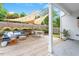 Outdoor deck area with comfortable seating, dining space, and stylish sunshade at 811 E Lane St, Raleigh, NC 27601