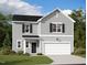 Charming two-story home with gray siding, black shutters, a well-manicured lawn, and an attached two-car garage at 914 Bombardier Aly, Spring Hope, NC 27882
