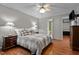 Bedroom featuring hardwood floors and access to an ensuite bathroom with a glass-enclosed shower at 1005 Stuart Dr, Mebane, NC 27302
