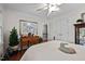 Bedroom featuring neutral decor, hardwood floors, and a double door closet that create a serene retreat at 1005 Stuart Dr, Mebane, NC 27302