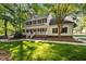 Charming two-story home with a large, inviting front porch and beautiful landscaping at 1005 Stuart Dr, Mebane, NC 27302
