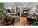 Comfortable living room with a brick fireplace, plush seating, and ample natural light, perfect for relaxation at 1005 Stuart Dr, Mebane, NC 27302