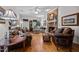 Spacious living room with hardwood floors, fireplace, and comfortable furnishings at 1005 Stuart Dr, Mebane, NC 27302
