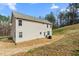 Exterior view of a home showcasing the backyard space and the home's architectural style at 1009 Haynoke Dr, Graham, NC 27253