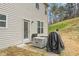 Exterior of a home showing a patio with a grill, offering outdoor cooking and entertainment possibilities at 1009 Haynoke Dr, Graham, NC 27253