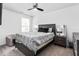 Charming bedroom featuring a patterned comforter, bedside tables, and modern ceiling fan at 1009 Haynoke Dr, Graham, NC 27253