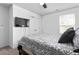 Bedroom with a comfortable bed, ceiling fan, and natural light from the window at 1009 Haynoke Dr, Graham, NC 27253