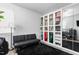 Spare bedroom features versatile space with black futon and closet with mirror at 1009 Haynoke Dr, Graham, NC 27253