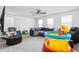 Large living room featuring playful toys and a cozy seating area at 1009 Haynoke Dr, Graham, NC 27253