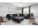 Spacious living room with a comfortable sectional sofa and bright natural lighting at 1009 Haynoke Dr, Graham, NC 27253