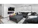 Cozy living room with a large sectional sofa, electric fireplace, and wall-mounted TV at 1009 Haynoke Dr, Graham, NC 27253