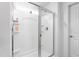 Modern shower with glass door, tiled walls, and shower essentials at 1009 Haynoke Dr, Graham, NC 27253