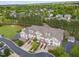 Wide aerial view of townhomes nestled in a lush, green community at 10410 Rosegate Ct, Raleigh, NC 27617