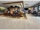 Stylish bar area featuring a long counter, comfortable seating, and ample lighting at 10410 Rosegate Ct, Raleigh, NC 27617