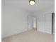 Bright bedroom with neutral carpet, closet, and access to other rooms in the house at 10410 Rosegate Ct, Raleigh, NC 27617