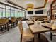 Bright dining area with large windows, modern lighting, and comfortable seating at 10410 Rosegate Ct, Raleigh, NC 27617