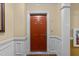 Solid wood front door with classic trim, offering privacy and security for a welcoming entryway at 10410 Rosegate Ct, Raleigh, NC 27617