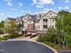 Charming townhome exterior featuring a blend of materials and a well-maintained landscape at 10410 Rosegate Ct, Raleigh, NC 27617