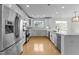 Bright kitchen with stainless steel appliances, granite countertops, and marble backsplash at 10410 Rosegate Ct, Raleigh, NC 27617