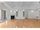 Spacious living room boasts a fireplace, built-in shelves, and large windows at 10410 Rosegate Ct, Raleigh, NC 27617