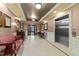 Elegant lobby area with seating, decorative details, and elevator access, creating a welcoming atmosphere at 10410 Rosegate Ct, Raleigh, NC 27617