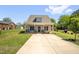 Charming home featuring a well-manicured lawn and long driveway at 109 E Fayetteville St, Micro, NC 27555