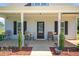 Charming front porch with seating area and landscaped accents at 109 E Fayetteville St, Micro, NC 27555