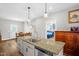 Open kitchen layout with stainless steel appliances and granite countertop at 109 E Fayetteville St, Micro, NC 27555