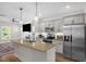 Modern kitchen with stainless steel appliances, granite countertops, and gray cabinetry at 109 E Fayetteville St, Micro, NC 27555