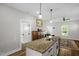 Open kitchen with granite countertops, pendant lighting and stainless steel sink at 109 E Fayetteville St, Micro, NC 27555