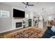 Inviting living room with fireplace and views into open kitchen at 109 E Fayetteville St, Micro, NC 27555