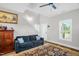 Cozy living area with natural light, stairs and comfortable blue sofa at 109 E Fayetteville St, Micro, NC 27555