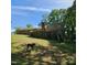 Spacious backyard featuring a large wooden deck with steps, perfect for enjoying outdoor living at 1102 Parkwood Dr, Siler City, NC 27344