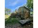 Large backyard featuring a two-story brick house and spacious wooden deck, great for outdoor entertaining at 1102 Parkwood Dr, Siler City, NC 27344
