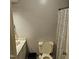 Compact bathroom with a white toilet, decorative shower curtain, and vanity at 1102 Parkwood Dr, Siler City, NC 27344
