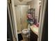 Bathroom with shower, toilet, and organized towel rack for practical and stylish storage at 1102 Parkwood Dr, Siler City, NC 27344