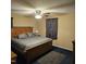 Bedroom featuring a large bed, ceiling fan with light, and neutral-colored walls for a cozy ambiance at 1102 Parkwood Dr, Siler City, NC 27344
