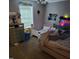 Bedroom featuring multiple beds and a window, with personal touches creating a unique space at 1102 Parkwood Dr, Siler City, NC 27344