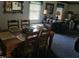 Dining room with a wooden table, seating for six, and a bright window at 1102 Parkwood Dr, Siler City, NC 27344